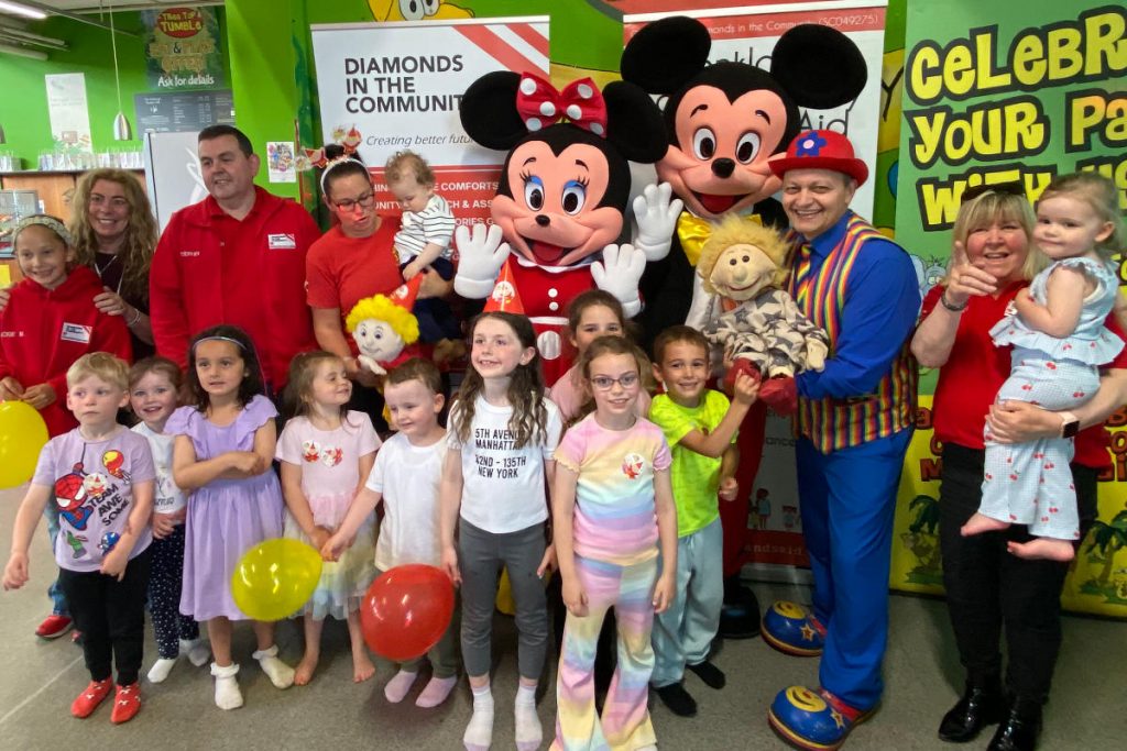 Mr Bumble poses with Micky and Minnie mouse and kids at Tree Tops in Coatbridge in Glasgow